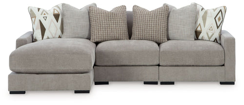 Pebble gray sectional sofa with chaise arms and geometric pattern throw pillows