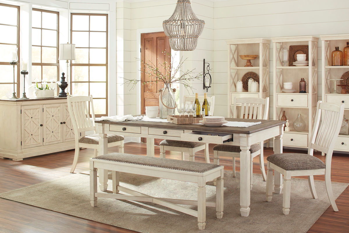 Rectangular dining table set with dark tabletop, beige side chairs, and cushioned bench