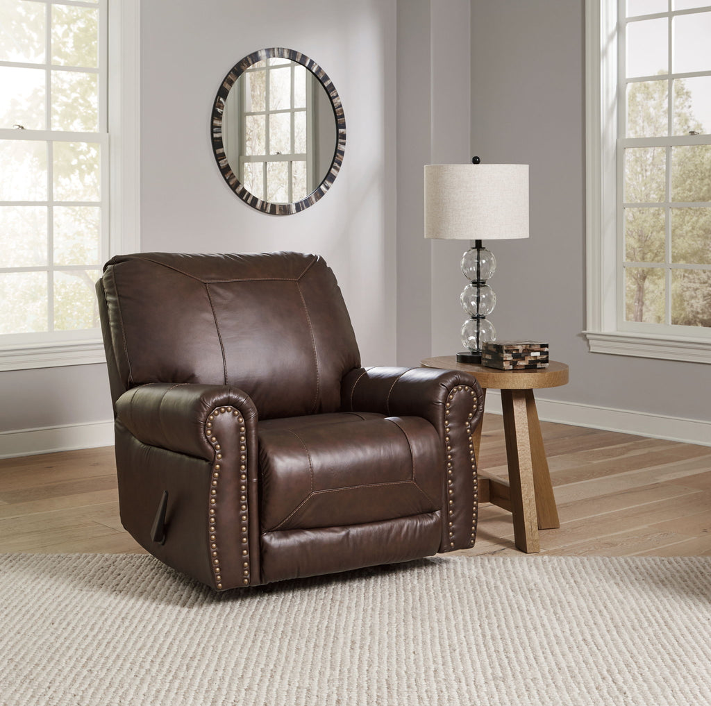 Dark brown leather-look rocker recliner with studded armrests and cushioned back
