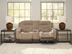 Power reclining loveseat with adjustable headrests, beige upholstery and two-tone arms.