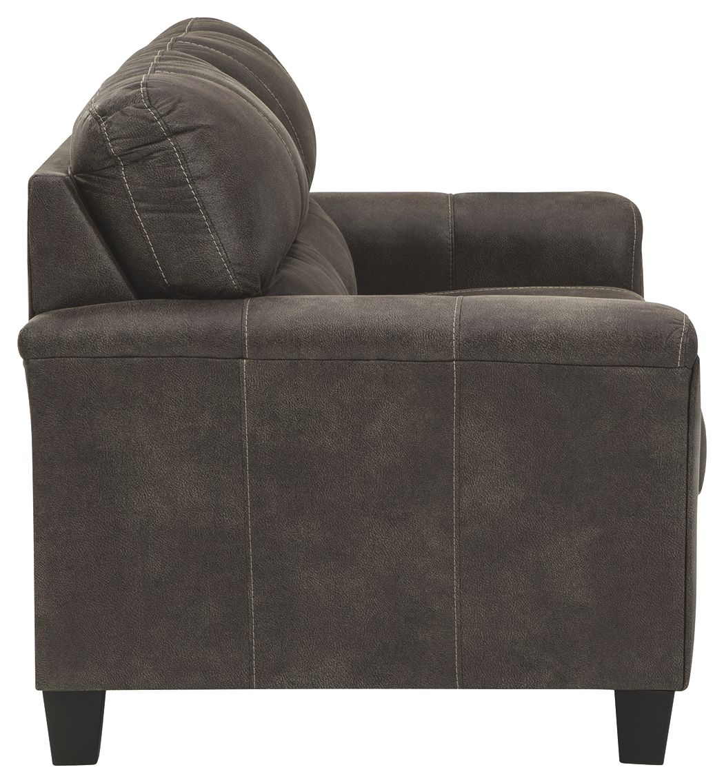 Smoke gray loveseat back and arm detail with curved headrest cushion and stitched panels