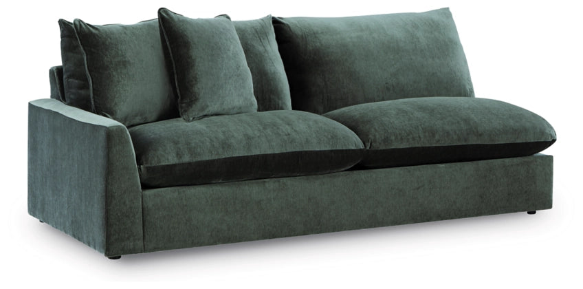 Jade green sectional sofa with rounded arms and three back pillows