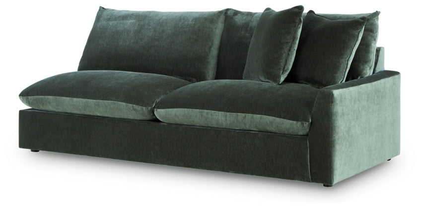 Jade green sectional sofa with multiple back pillows and low arms
