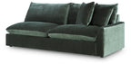 Jade green sectional sofa with multiple back pillows and low arms