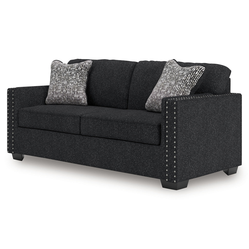 Coal fabric sofa with nailhead-trimmed sides and two heather gray throw pillows