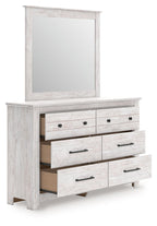 Whitewash six-drawer dresser with open shelving and a tall mirror