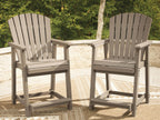 Pair of medium-brown Seacliff Beach barstools with slatted seats, backs, and armrests