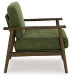Green accent chair side view with tall back and upholstered seat cushion