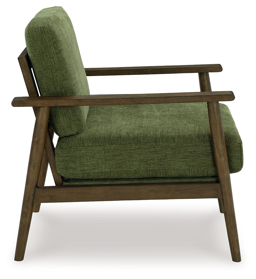 Green accent chair side view with tall back and upholstered seat cushion