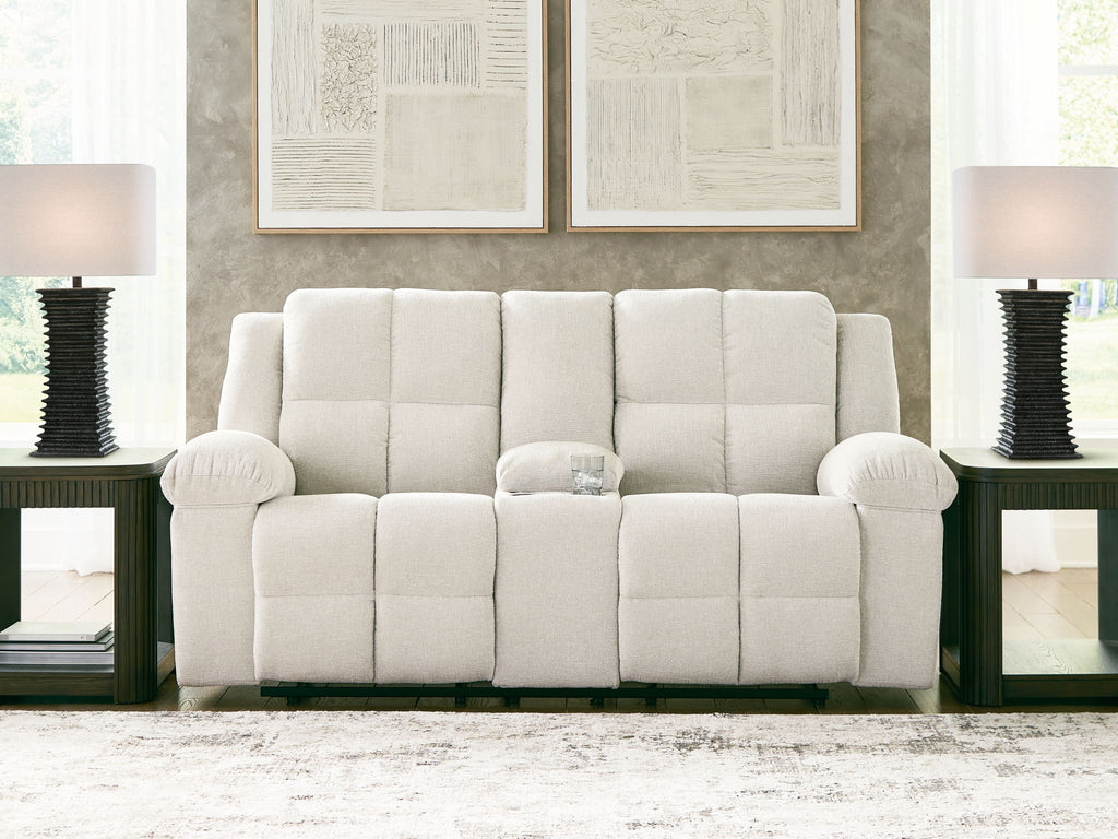 Reclining loveseat with console, light beige tufted upholstery, wide back and arm caps