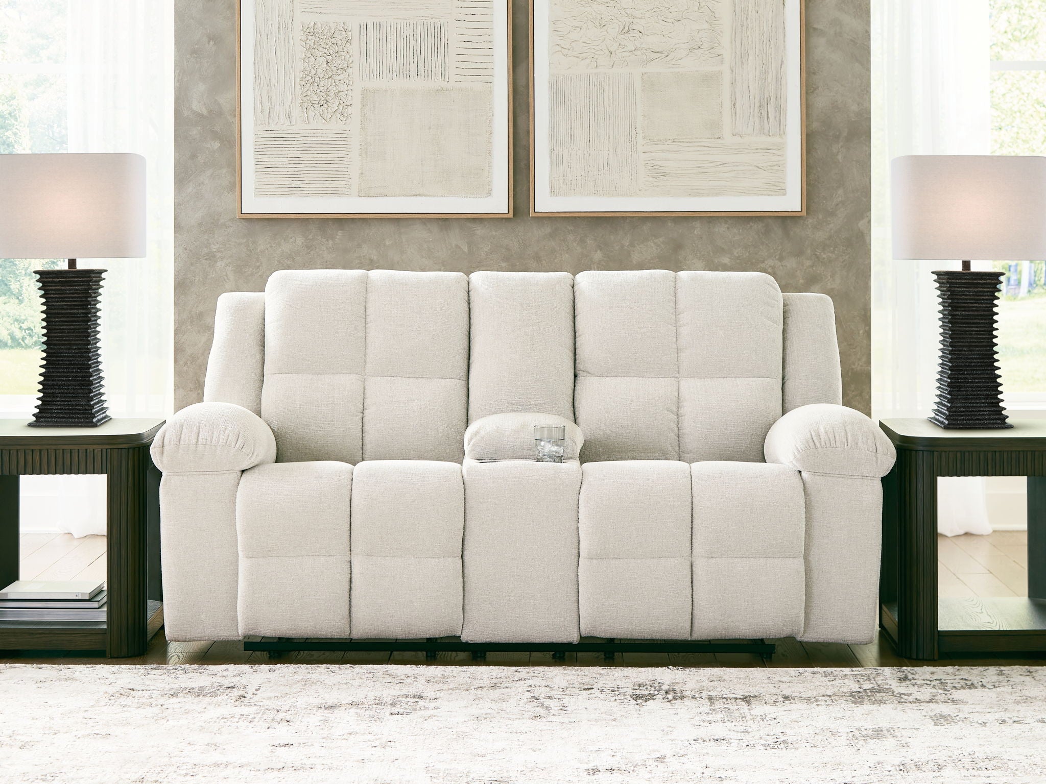 Reclining loveseat with console, light beige tufted upholstery, wide back and arm caps