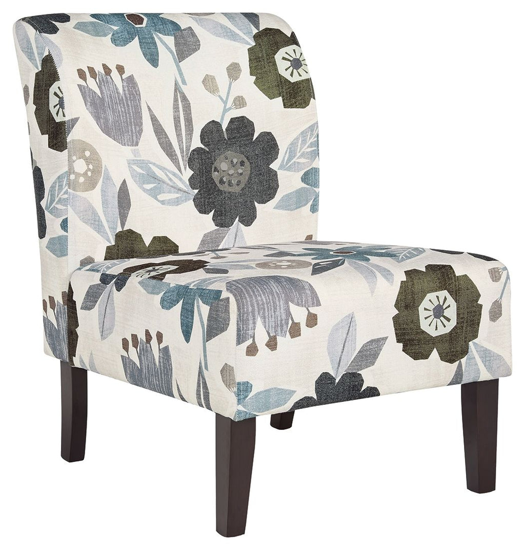 Accent chair with light base and blue-gray floral fabric, dark wooden legs.