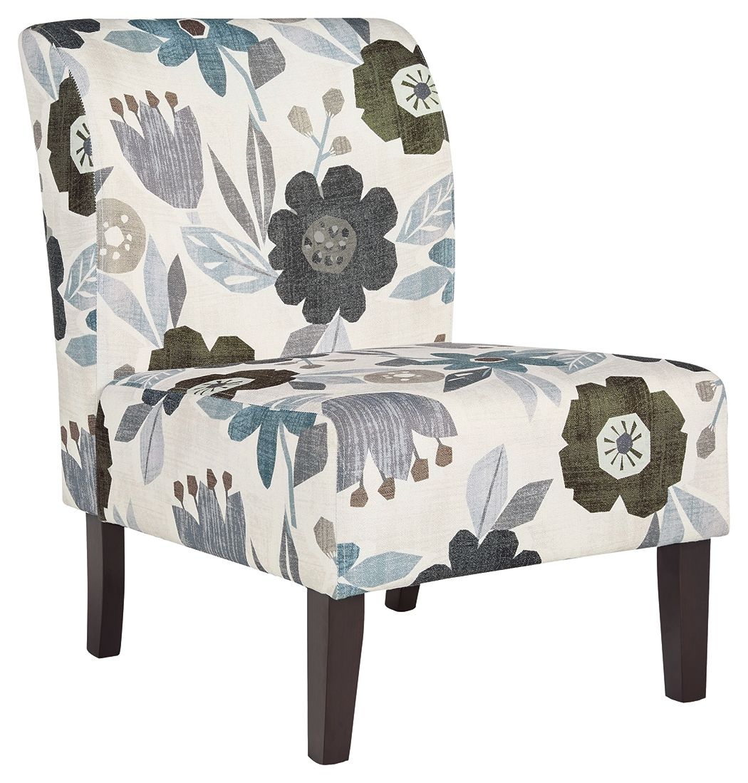 Accent chair with light base and blue-gray floral fabric, dark wooden legs.