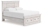 Panel storage bed with whitewashed wood frame, upholstered white mattress, and two front drawers