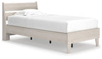 Beige panel platform bed with white mattress and two pillows