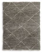 Dark gray area rug with distressed pattern and short shag pile