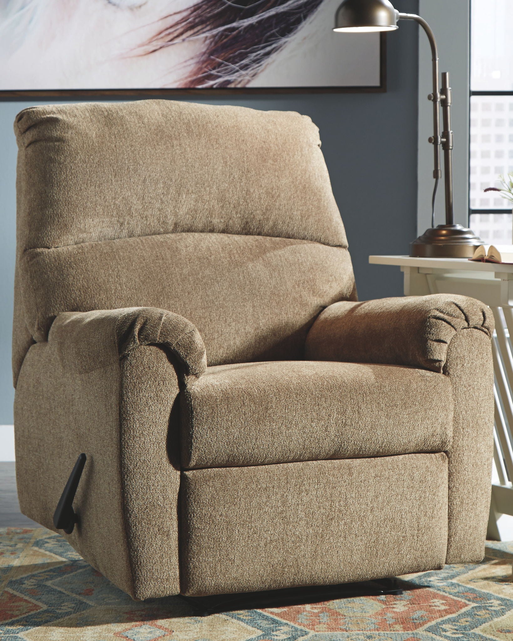 Tan fabric recliner chair with padded back and rounded arm detail