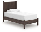 Dark brown panel platform bed frame with white mattress and pillow