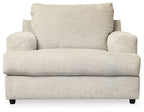 Stone-colored upholstered chair with tall back cushion, wide seat, and sturdy dark legs