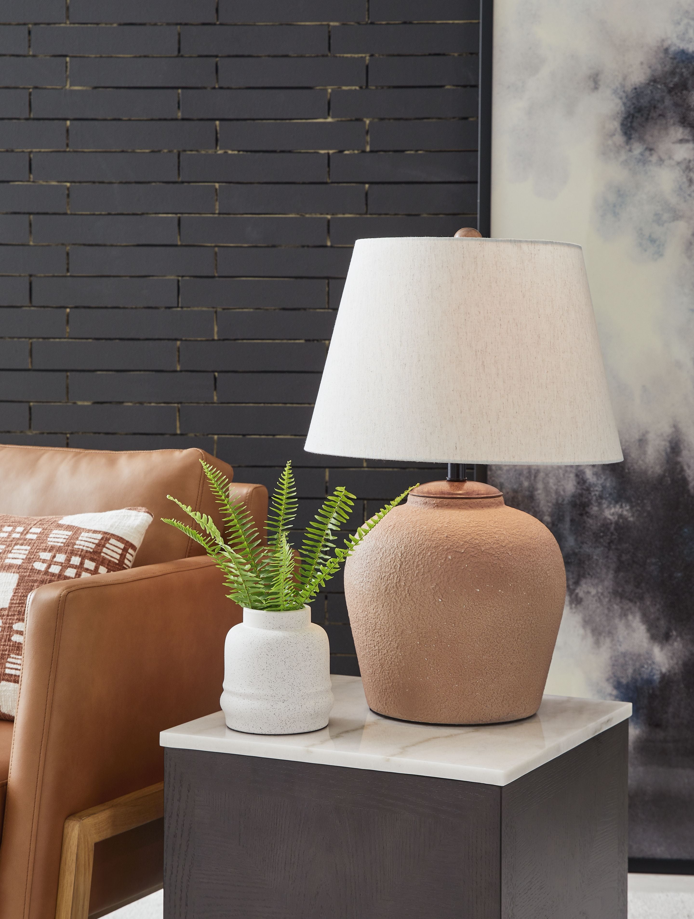 Metal table lamp with rust ceramic base and white fabric drum shade
