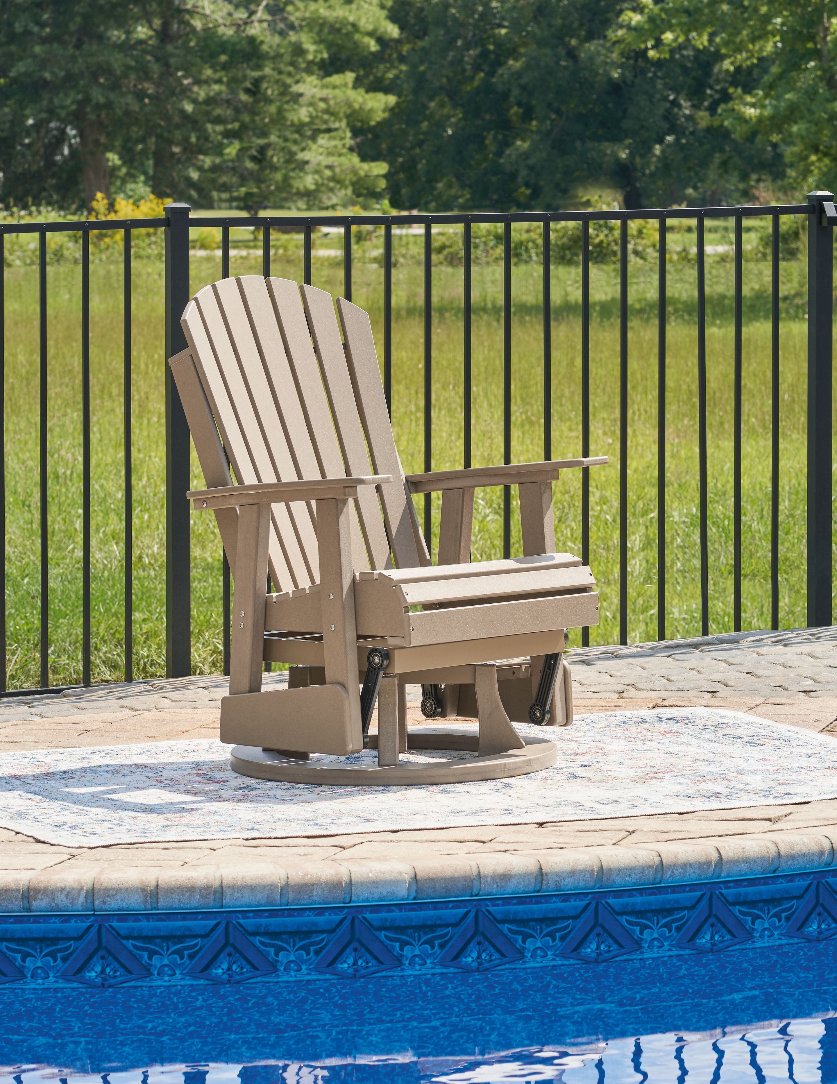 White swivel glider chair with slatted back, armrests, and wide base