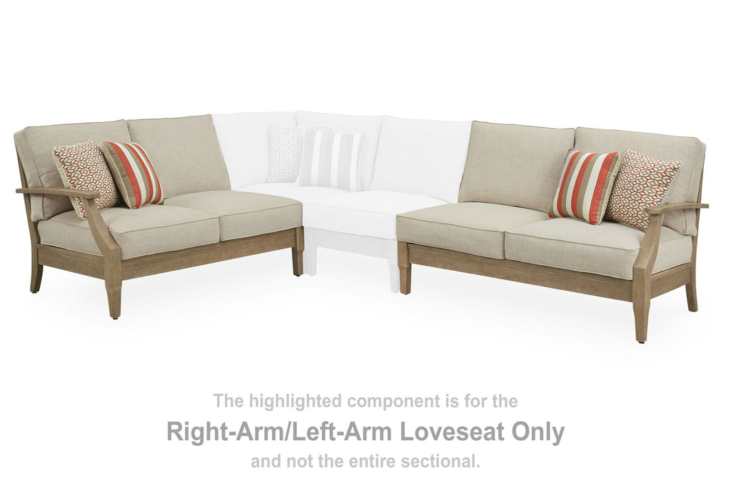 Beige L-shaped sectional loveseat set with four seat cushions and striped pillows
