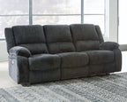 Draycoll reclining sofa in slate, high tufted back and padded recliner arms