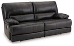 Black leather-look sofa with padded arms and tufted back cushions, front view