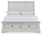 White sleigh bed with two drawers beneath and paneled headboard