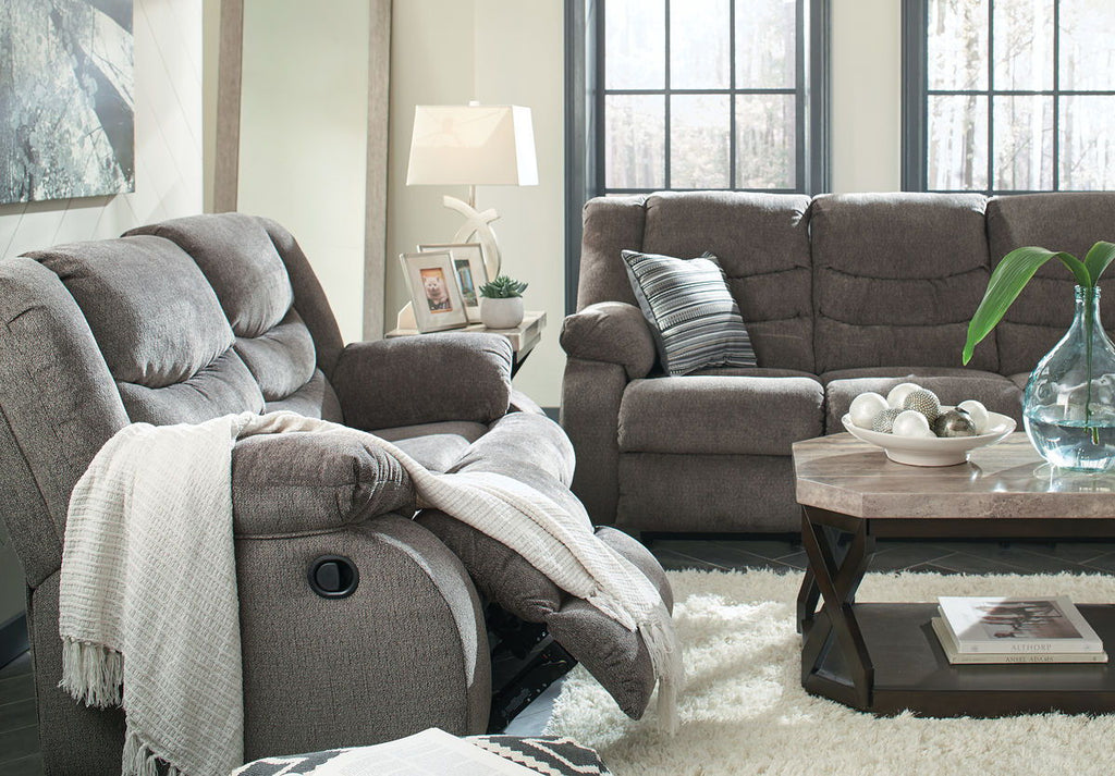 Gray reclining loveseat and armchair-style recliner with pillows, plush fabric