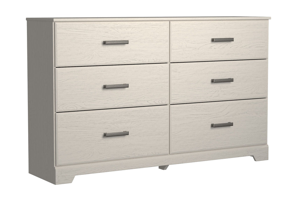 White six-drawer dresser with six drawers and black metal bar pulls