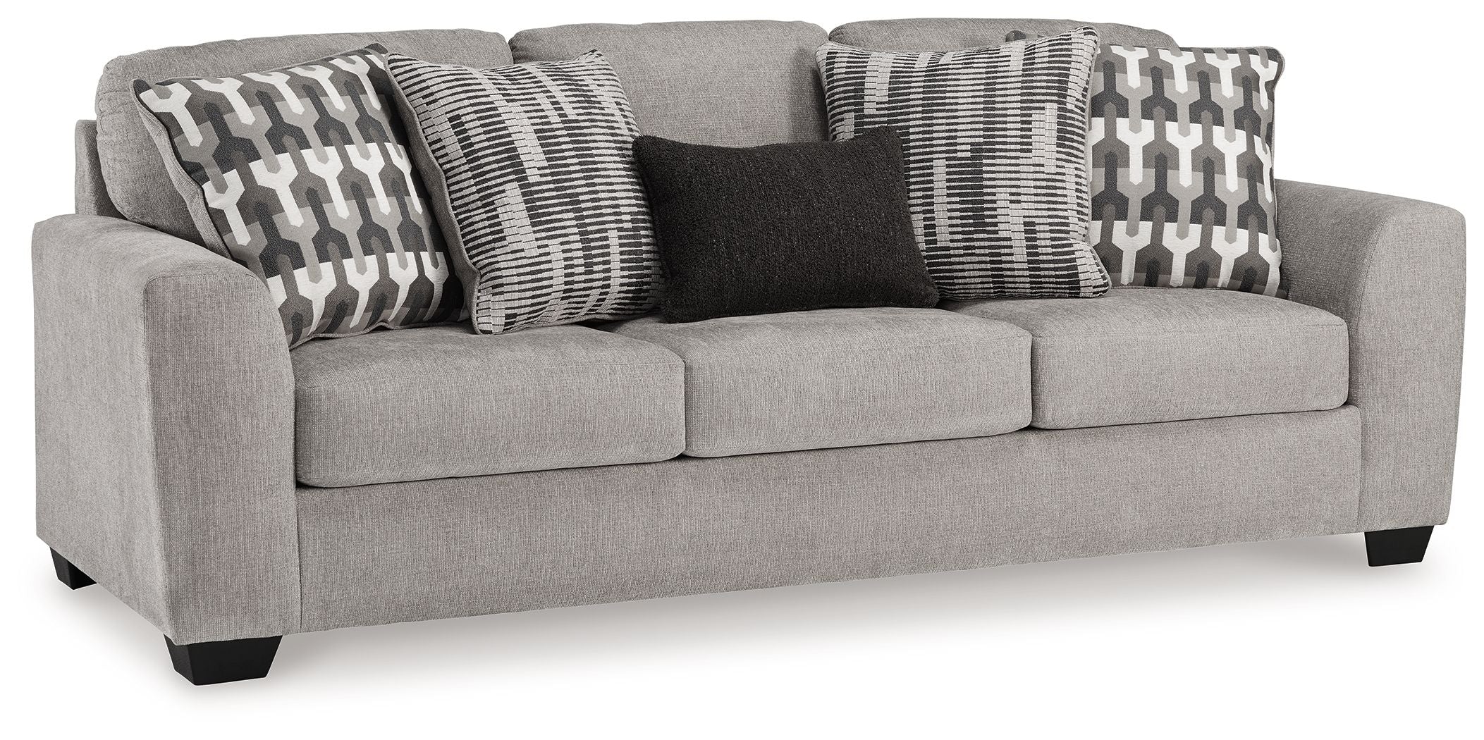 Gray flannel sofa with three upholstered seat cushions and patterned throw pillows