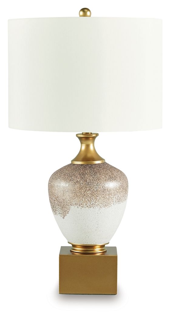 Glass table lamp with gold base, brown-speckled white body, white drum shade.