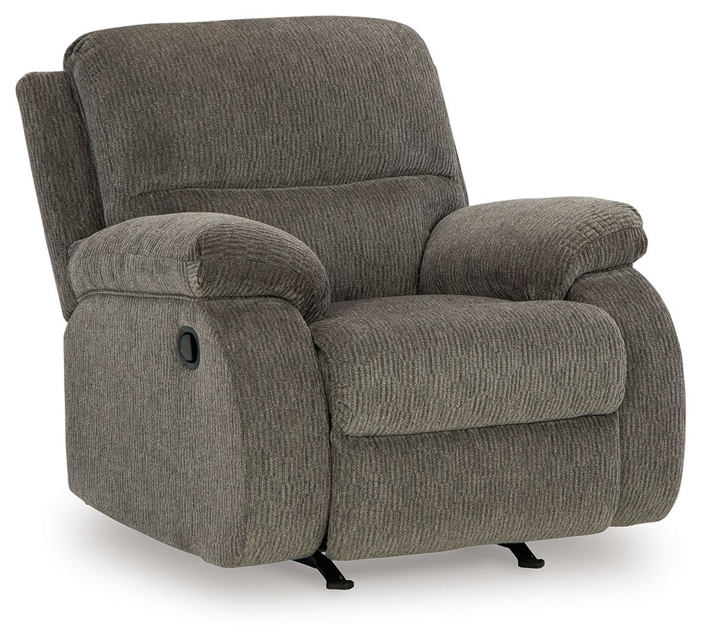 Dark gray rocker recliner chair with high backrest, rounded arm cushions, and base