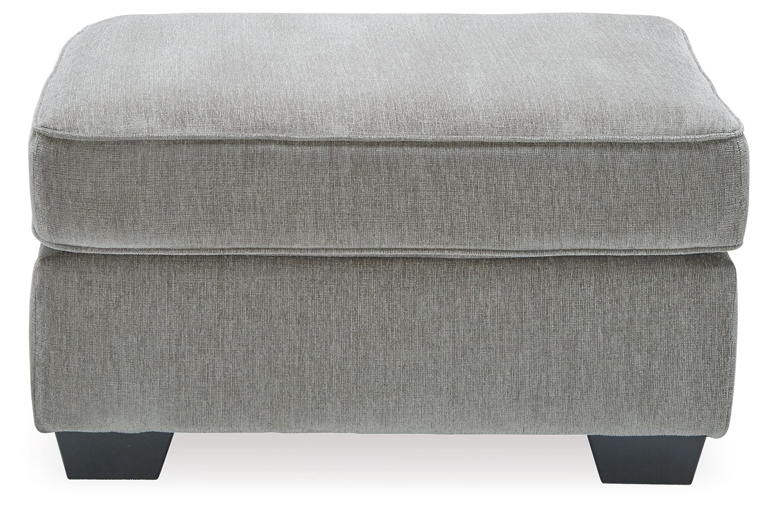 Light gray upholstered accent ottoman with smooth padded seat and short block legs