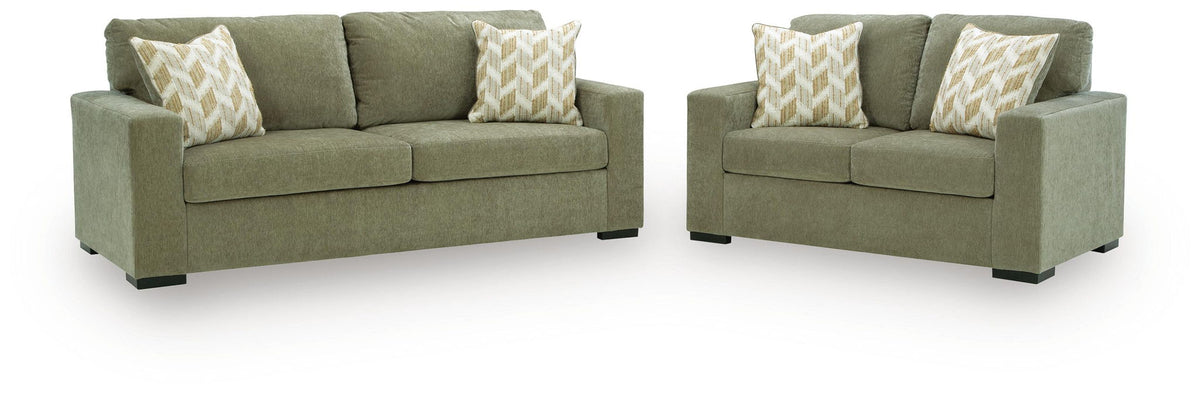Bridgepoint living room set: green sofa and loveseat with patterned beige throw pillows