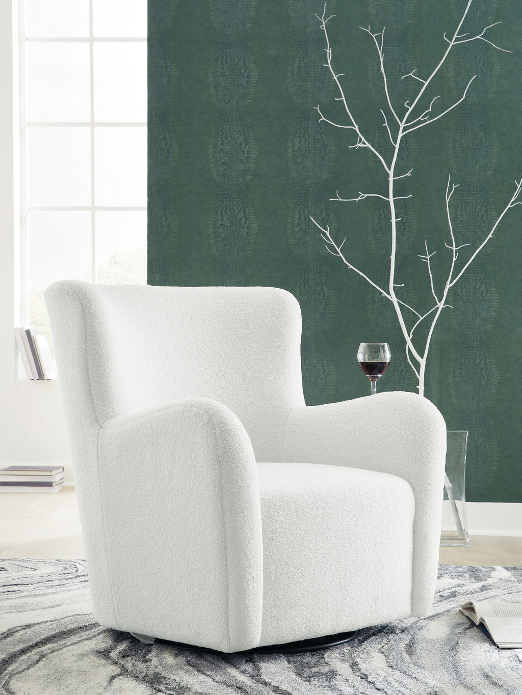 White swivel glider accent chair with rounded arms, tall back, and circular swivel base