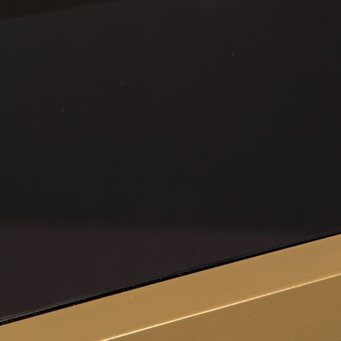 Dark brown bookcase shelf edge with gold trim detail