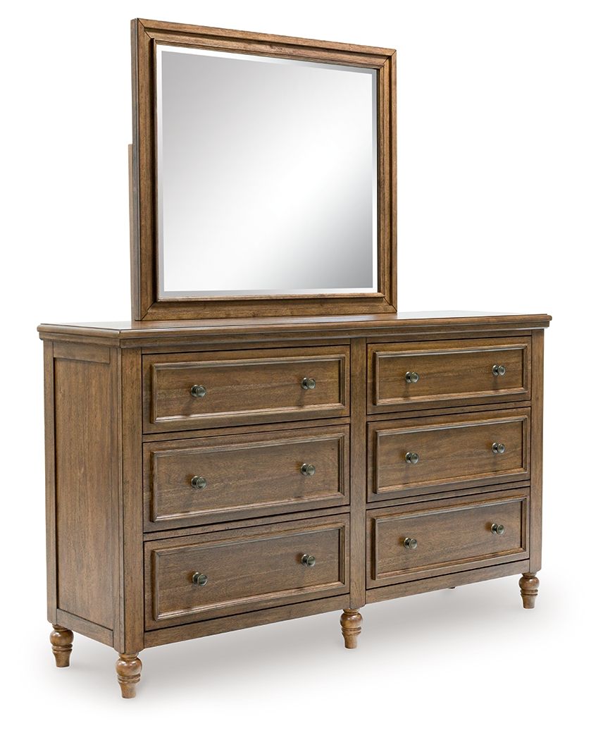 Dark brown dresser with rectangular mirror and eight drawer fronts with metal pulls