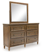 Dark brown dresser with rectangular mirror and eight drawer fronts with metal pulls