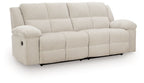 Light beige 2-seat reclining sofa with track arms and padded headrests