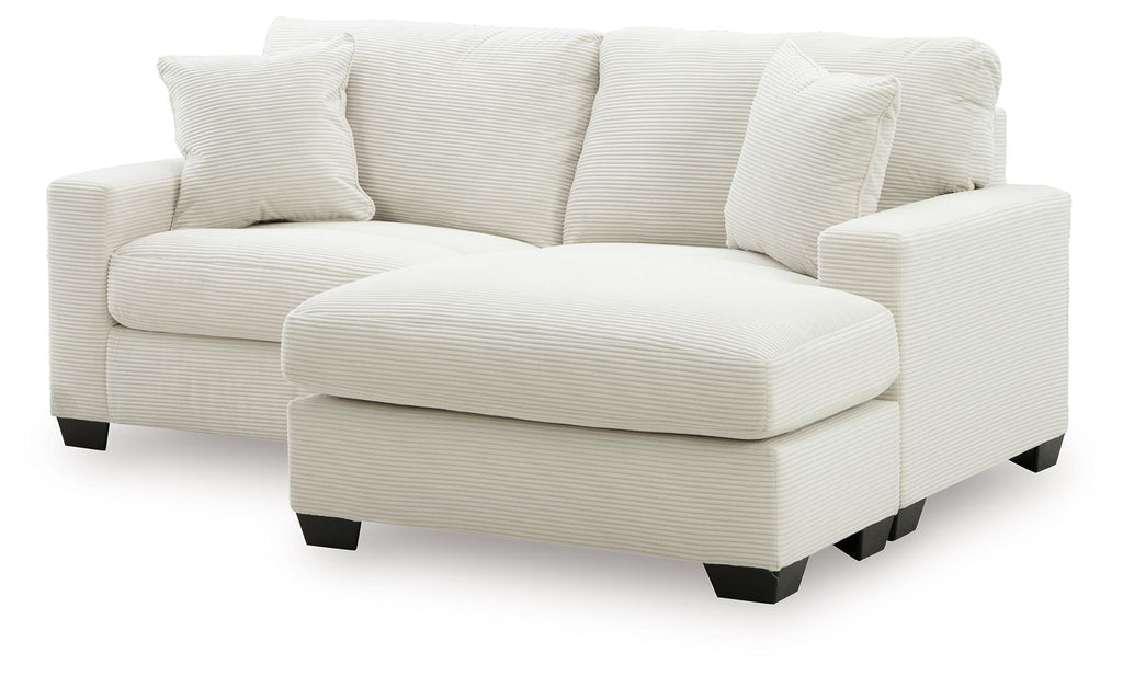 Light gray sofa chaise with two back cushions and a chaise ottoman extension