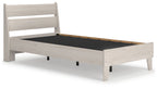 Beige panel platform bed frame with dark interior platform base