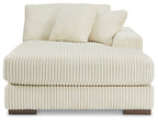 Ivory corner chaise sofa with thick seat padding and two striped back pillows
