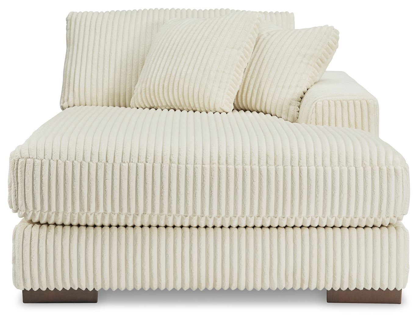 Ivory corner chaise sofa with thick seat padding and two striped back pillows