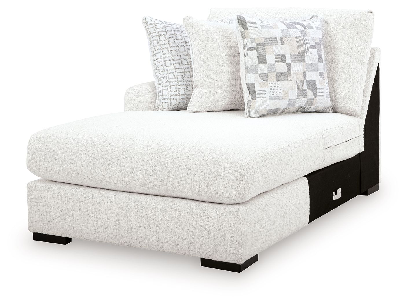 Chalk corner chaise with padded arm, deep seat, and two patterned throw pillows
