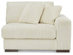 Ivory ribbed corner chair with two back cushions and wide square arm