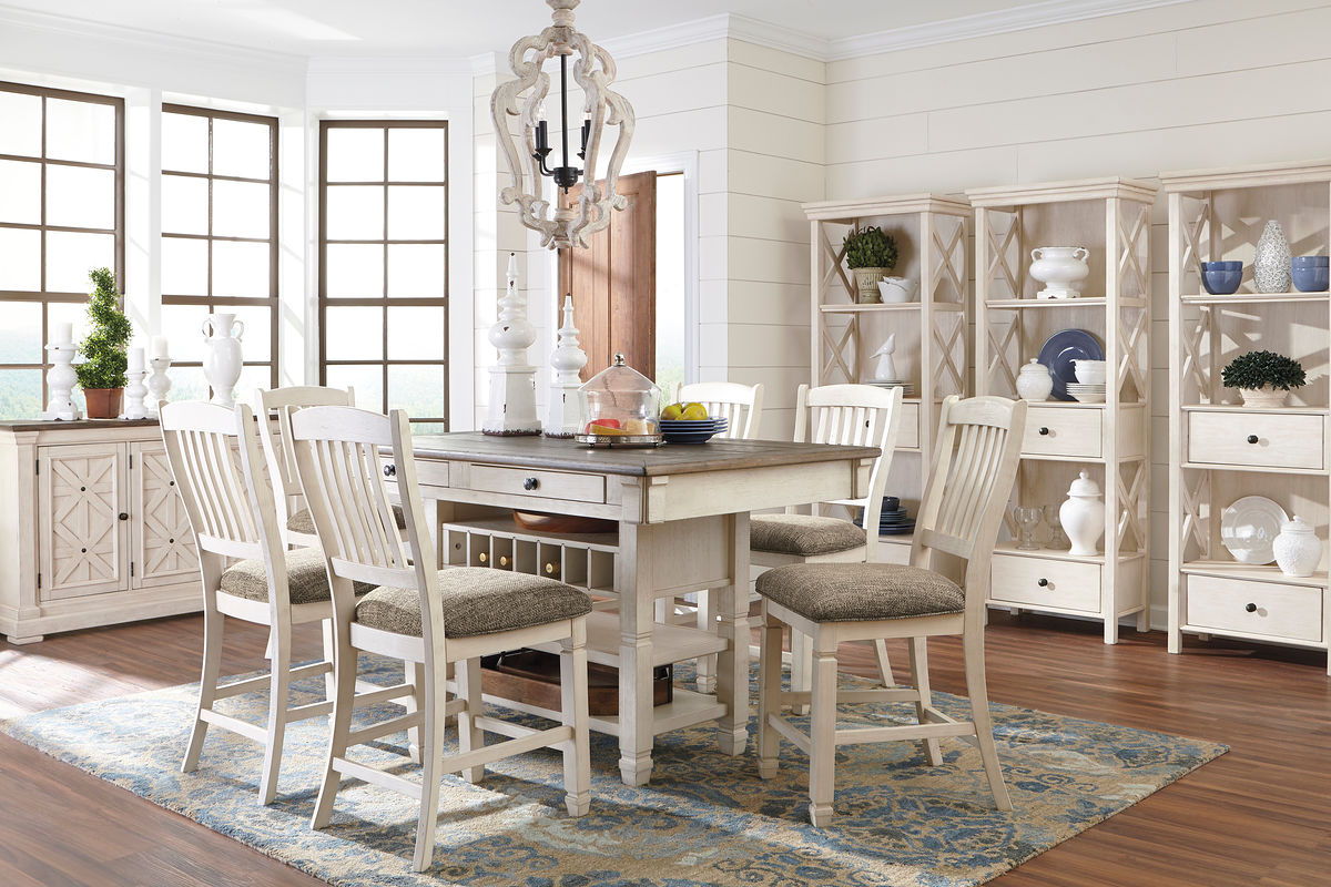 Beige dining table set with rectangular table, cushioned chairs, and sideboard buffet