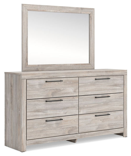 Six-drawer dresser with framed mirror and light wood drawer fronts with metal bar pulls.