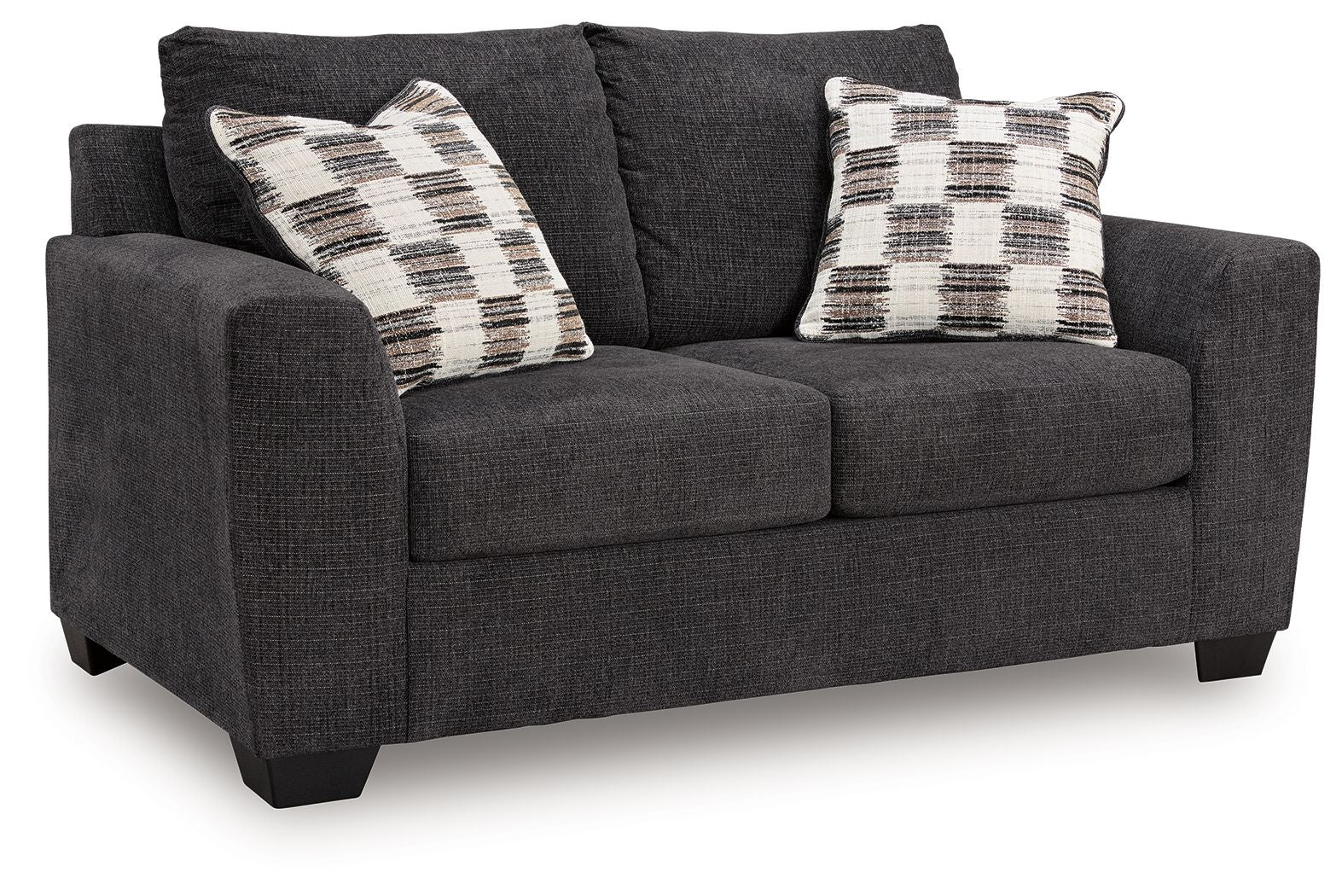 Dark gray loveseat with two plaid throw pillows and padded rolled arms